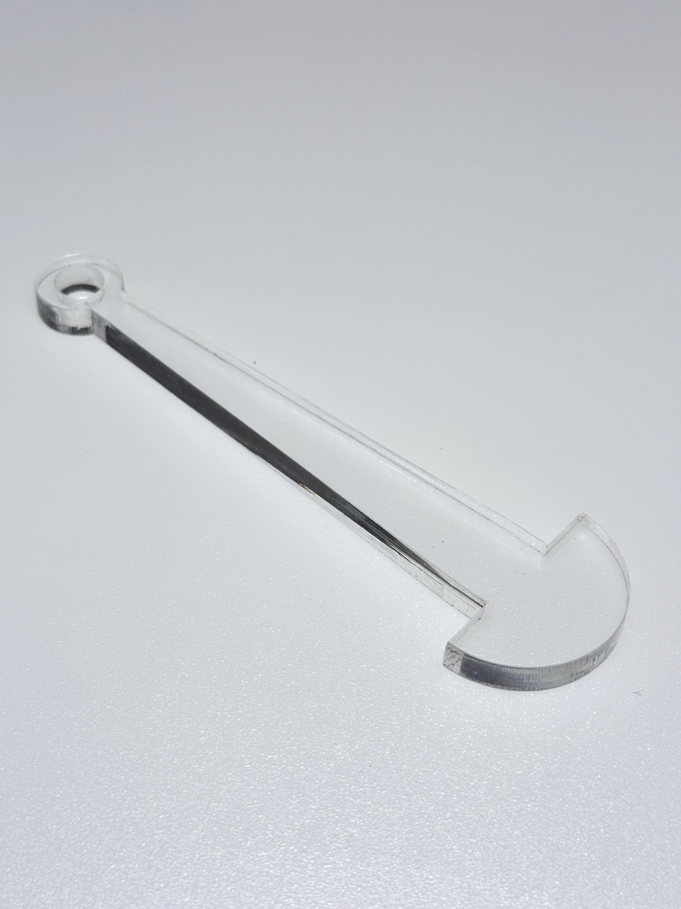 clear plastic mini minder stick on a white background