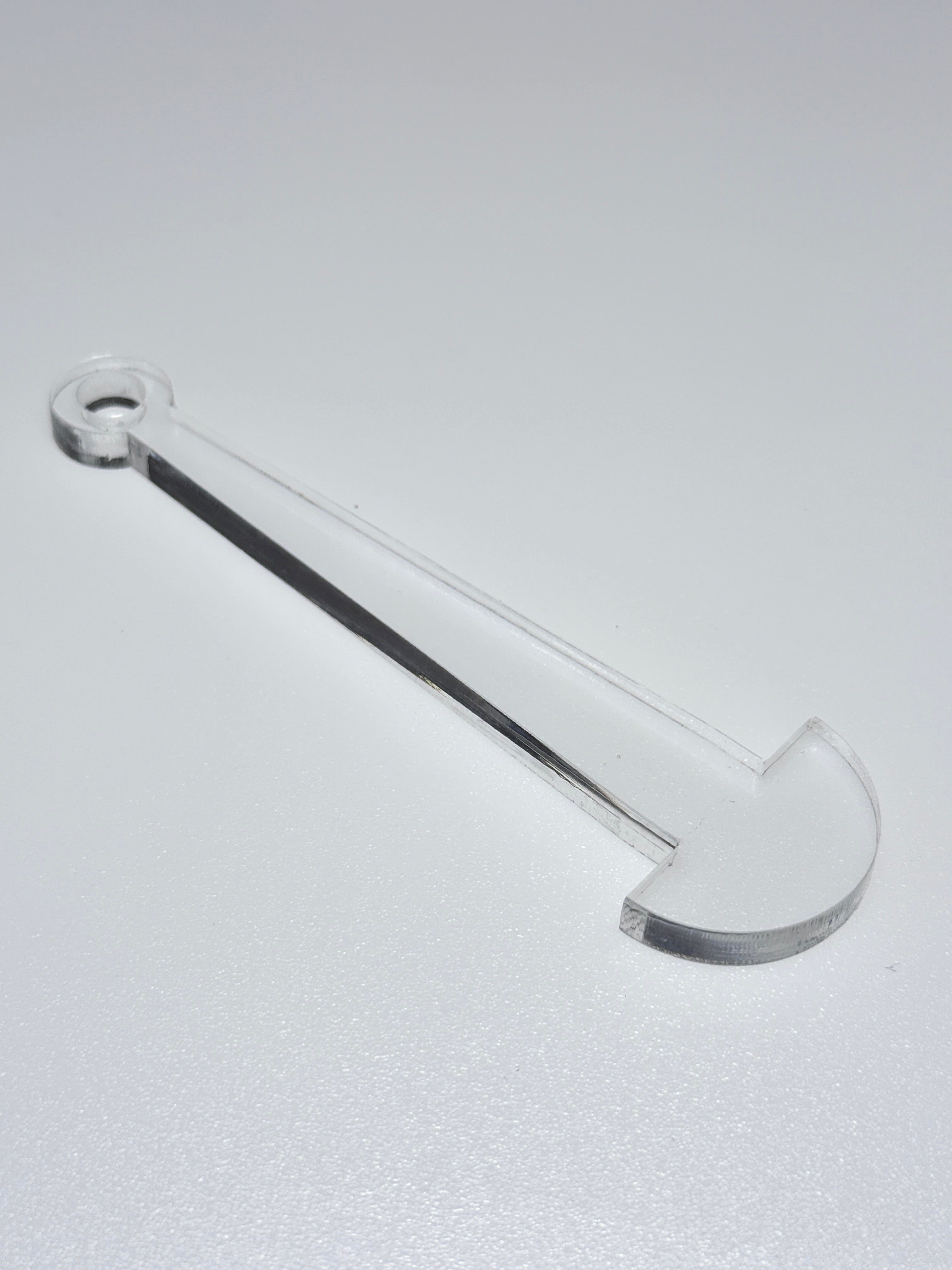 clear plastic mini minder stick on a white background