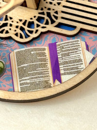 A detail image of the Mini Minder plate featuring an open book showing two pages from Pride & Prejudice.